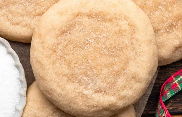 Soft and chewy sugar cookies on a baking tray, freshly baked and delicious.