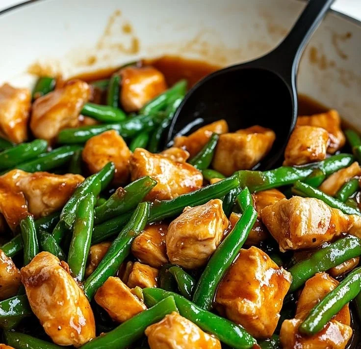 Quick chicken breast dish served with fresh green beans on a plate.