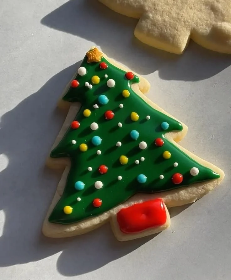Christmas Cookie Icing 3 Decorated Christmas cookies with colorful icing for festive celebrations