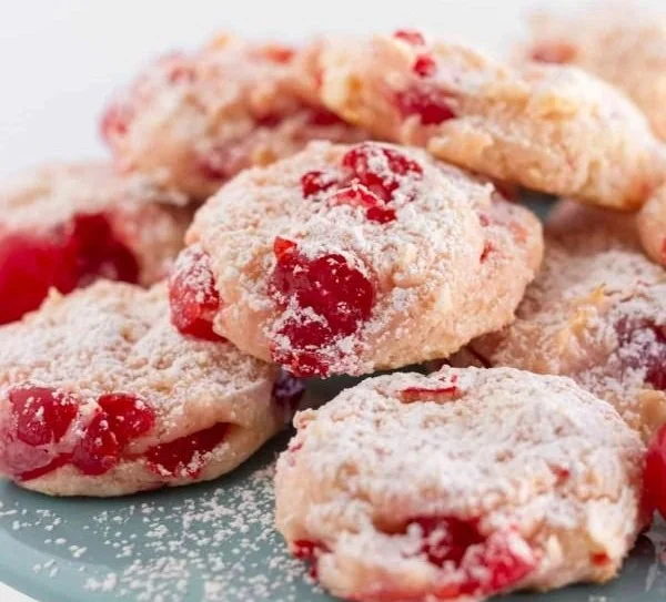 Delicious maraschino cherry cookies on a baking tray.